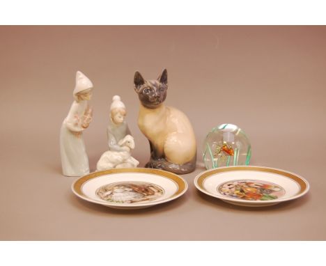 A Royal Copenhagen Siamese cat, together with two others, plus a selection of Royal Copenhagen Hans Christian Anderson plates