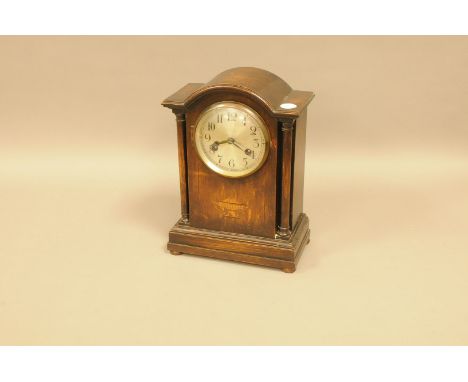 A first half 20th century mantle clock, stained case, 32cm, with eight day movement 