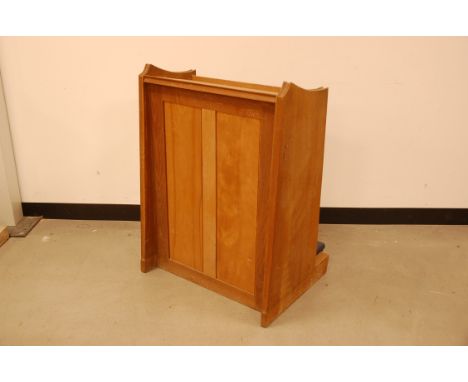 An early 20th century light oak church bible stand, with blue vinyl knee rest to base 