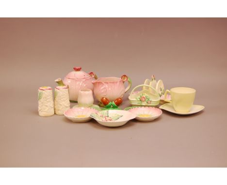 An assortment of Carltonware, in pink, grenn and yellow, with floral design, including teapots, dishes, salt and pepper, toas
