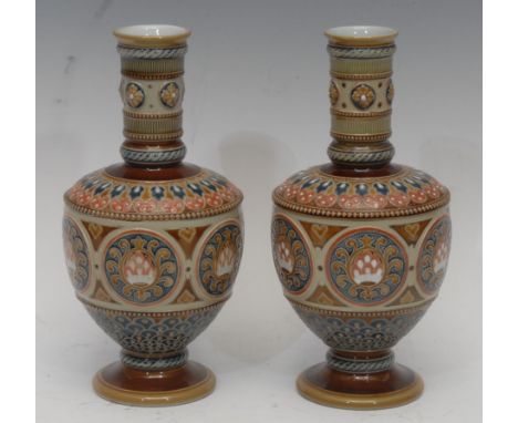 A pair of late 19th century Villeroy and Boch Mettlach vases, relief moulded with floral roundels and beaded bands, brown sal