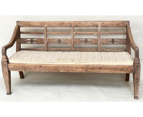 BENCH, antique Anglo Colonial style teak with lattice back, down swept arms and later buttoned cushion, 188cm W. 