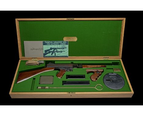 A CASED DEACTIVATED THOMPSON 'M1928A1' SUBMACHINE GUN, serial no. 70841, manufactured by Auto Ordnance, fitted with a finned 