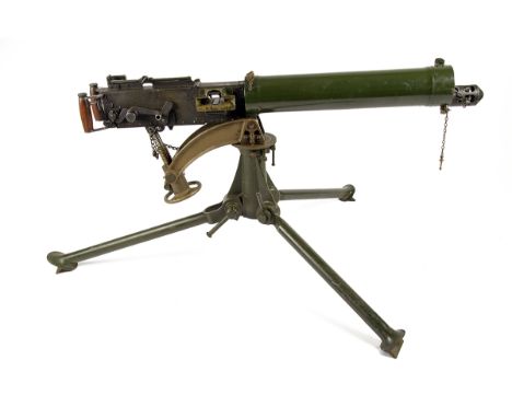 A DEACTIVATED VICKERS MEDIUM MACHINEGUN WITH TRIPOD AND TRANSIT CASE, serial no. B2068, manufactured in 1944 and believed Can