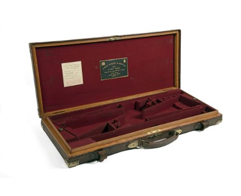 JAMES PURDEY &amp; SONS A BRASS-CORNERED LEATHER DOUBLE GUNCASE, fitted for 26in. barrels (could adapt to 31in.), the interio