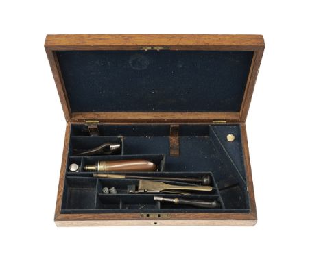 A GOOD ENGLISH OAK PERCUSSION REVOLVER CASE WITH PERIOD ACCESSORIES, measuring externally 13 3/4in. by 7 7/8in. by 2 1/2in., 