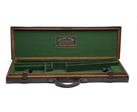 A BRASS-CORNERED OAK AND LEATHER SINGLE GUNCASE, fitted for 30in. barrels, the interior re-lined with green baize, a leather 