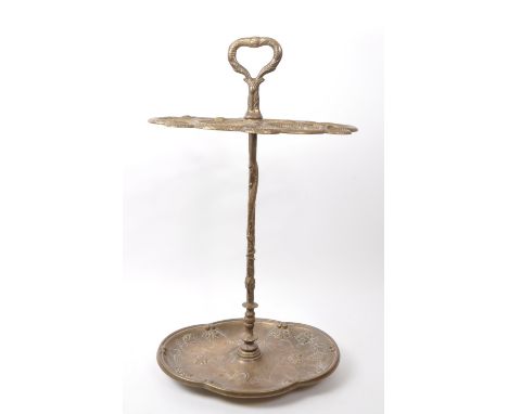 Victorian 19th century / early 20th century brass serpentine umbrella / stick stand. Having an embossed drip tray with foliat