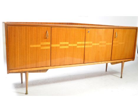 British Modern Design - A vintage mid 20th century walnut inlaid sideboard credenza. The sideboard raised on tapered dansette
