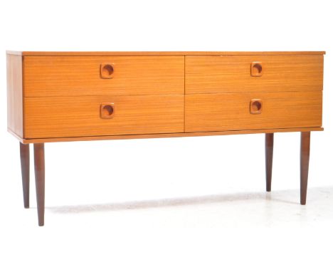 A vintage 20th century Schrieber manner teak sideboard credenza. Teak veneer chest of drawer with parallel bank of two drawer