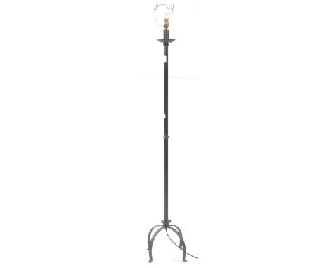 A modern ebonised metal floor standing standard lamp. Light fixing to top with square metal tubular body on curved four point