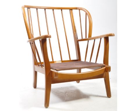 Ercol Furniture - Mid centruy teak armchair frame. Spindle back with wings with fabric slats and flat elbow rests all raised 