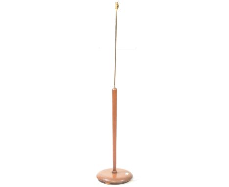 British Modern Design - A mid century teak and brass floor standing standard lamp light. Light fixing to top, central brass c