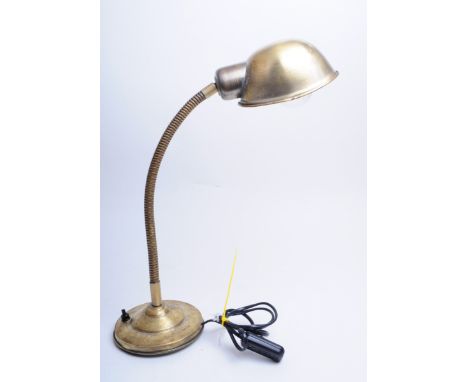 An Italian mid century 1950s industrial retro brass gooseneck desk lamp with conical shade and adjustable arm raised on a cir