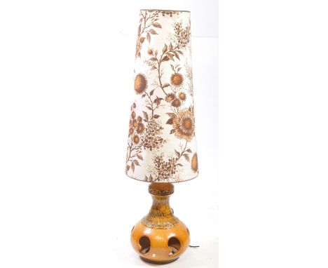 Mid century retro West German ceramic large lamp base in an orange and green colourway with original conical shade decorated 
