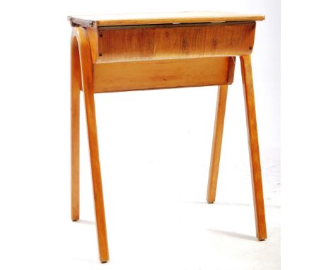 A vintage mid 20th century elm wood school desk table. The desk raised on bentwood supports, having writing slope top. Hinged