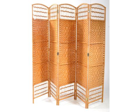 A vintage mid century five fold room divider / discretion screen. With cane and rattan woven work throughout, arched top with