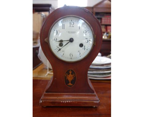 AN EDWARDIAN INLAID MAHOGANY BALLOON SHAPED MANTEL CLOCK, with enamel dial inscribed 'T Braybrooke, Dorchester', with two tra