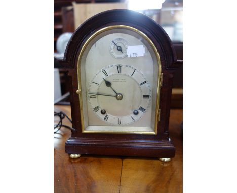 AN EARLY 20TH CENTURY MAHOGANY CASED MANTEL CLOCK of 18th Century design with arched silvered dial inscribed 'Wm Lister &amp;