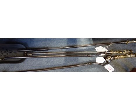 A SET OF THREE 19TH CENTURY STEEL FIRE TOOLS with cast brass handles