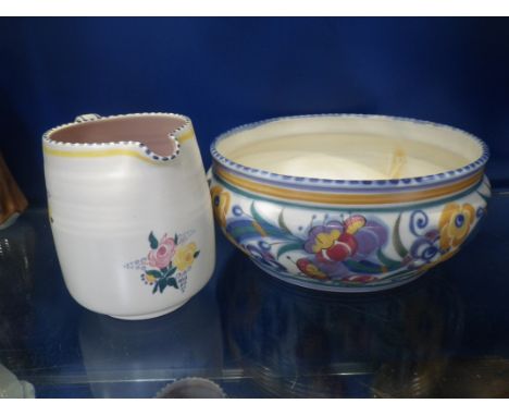 A TRADITIONAL POOLE POTTERY BOWL and a similar jug (2)