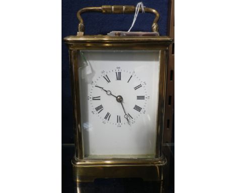 AN EDWARDIAN BRASS CASED CARRIAGE CLOCK with repeater, 15cm high