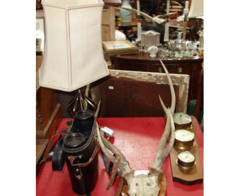 A PAIR OF ANTLERS mounted on oak shield, a pair of Russian binoculars, a lamp and a barometer