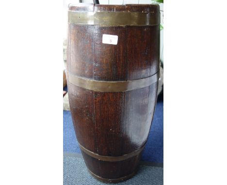 AN OAK STICK STAND OF COOPERED BARREL FORM, 73cm high