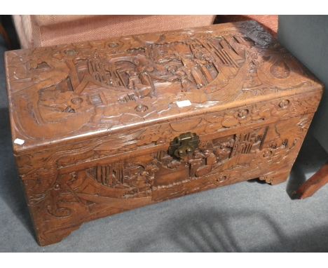 A CARVED CAMPHOR WOOD TRUNK, 94cm wide