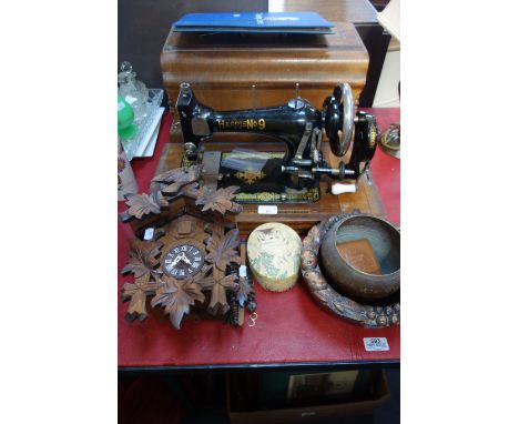 AN EDWARDIAN 'HARRIS NO 9' SEWING MACHINE in walnut case, a cuckoo clock and sundries
