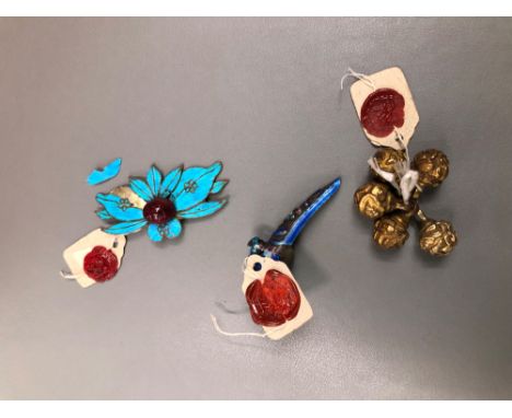 AN EASTERN ENAMEL FINGER TIP FINGER NAIL RING, A SET OF FIVE METAL BEADS, AND A LOTUS APPLIQUE. 