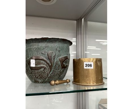 AN ARTS AND CRAFTS COPPER PLANTER, A BRASS FIRE IRON HANDLE AND A SHELL CASE