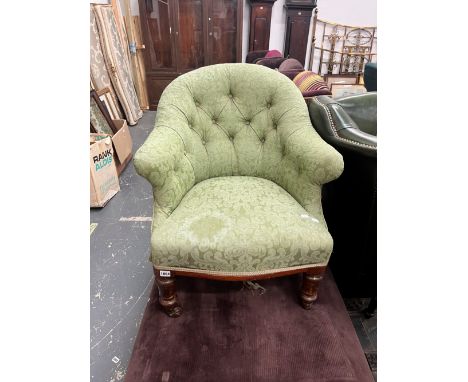 A VICTORIAN BUTTON BACK MAHOGANY ARMCHAIR