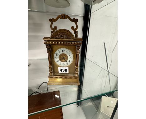 A CARRIAGE CLOCK STRIKING ON A COILED ROD