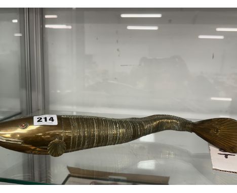 AN EASTERN SEGMENTED BRASS MODEL OF A FISH