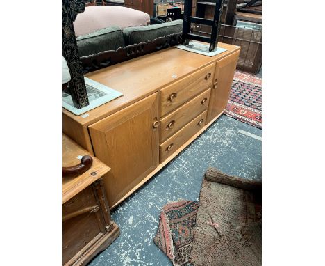 AN ERCOL ELM SIDEBOARD. w 154 D 45 H 69 cm