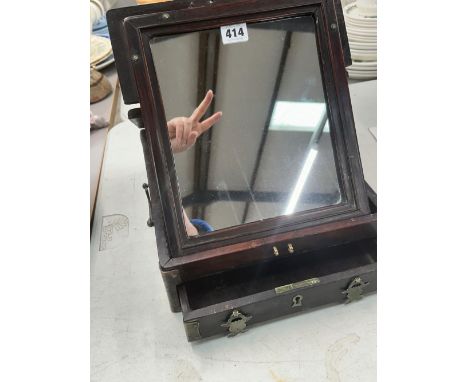 A CHINESE HARDWOOD FRAMED FOLDING MIRROR WITH A DRAWER BELOW.