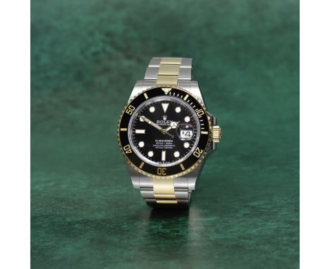 Rolex. A stainless steel and 18K gold automatic calendar bracelet watchModel: Submariner DateReference: 126613LNDate: Purchas