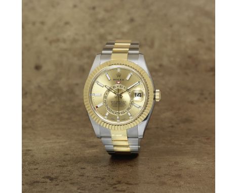 Rolex. A stainless steel and 18K gold automatic annual calendar bracelet watch with dual time zoneModel: Sky-DwellerReference