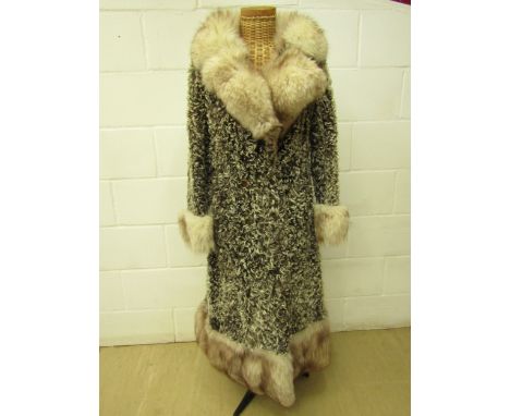Revillon boutique Paris Saks Firth Avenue, Persian lamb double breasted fur coat. Late 1960's early 70's in style, the collar