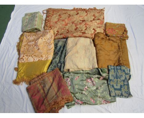 Silk damasks, brocades silk moirés, a crewel embroidered panel comprising ten pieces including a small piece of Voysey tapest