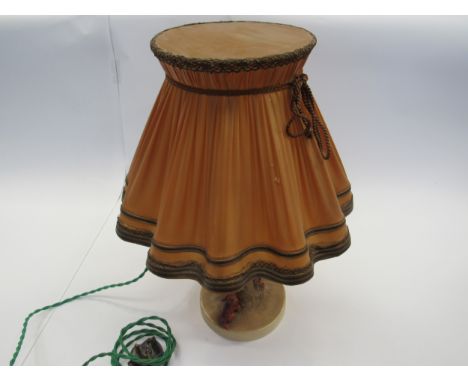 A Goebel late 1940's table lamp, young girl perched on a tree with dog at her feet holding her slipper, original shade 