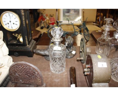 A silver mounted cut glass spirit decanter; and a silver "whisky" label