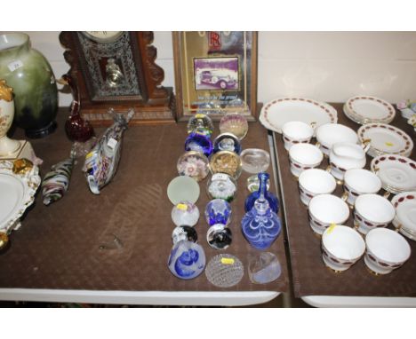 A collection of various coloured glass paperweights, scent bottles etc. some Caithness and Mats Jonasson