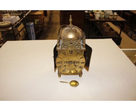 An antique brass lantern clock AF