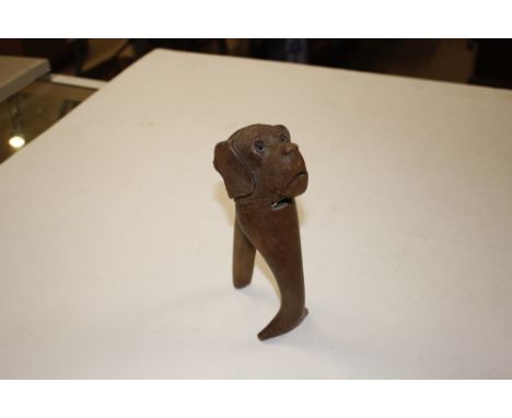 A carved wooden dog nutcracker 