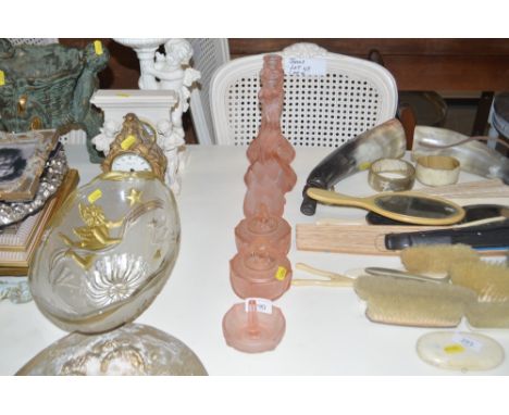 An Art Deco pink tinted glass dressing table set including mermaid decorated candle sticks