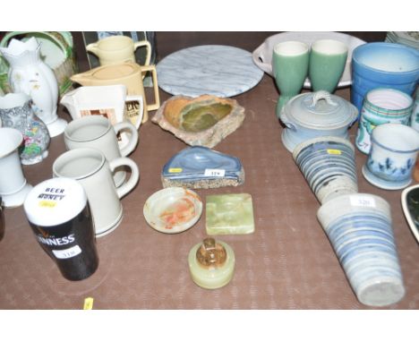 A quantity of onyx ashtrays; an onyx cigarette lighter and a cheese board