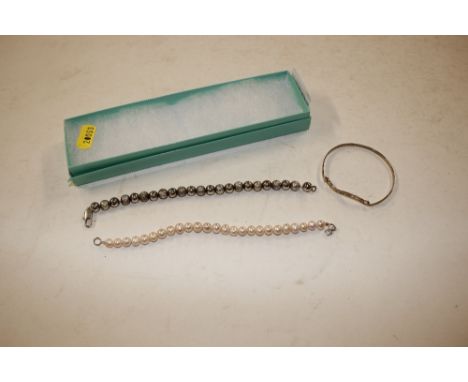 A simulated pearl necklace, one other and a white metal bangle