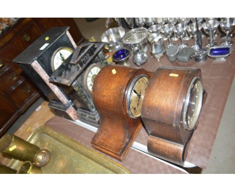 A marble cased mantel clock; an ebonised cased Victorian clock; and two 1930's oak cased clocks